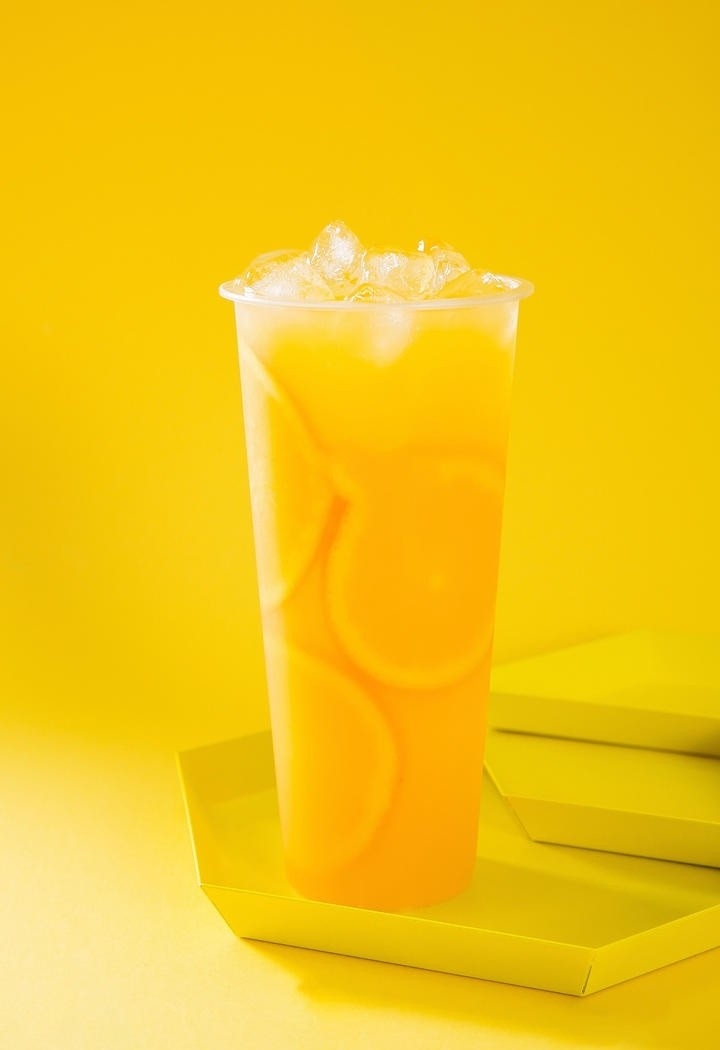 鲜榨果汁摄影 奶茶店鲜榨橙汁海报素材